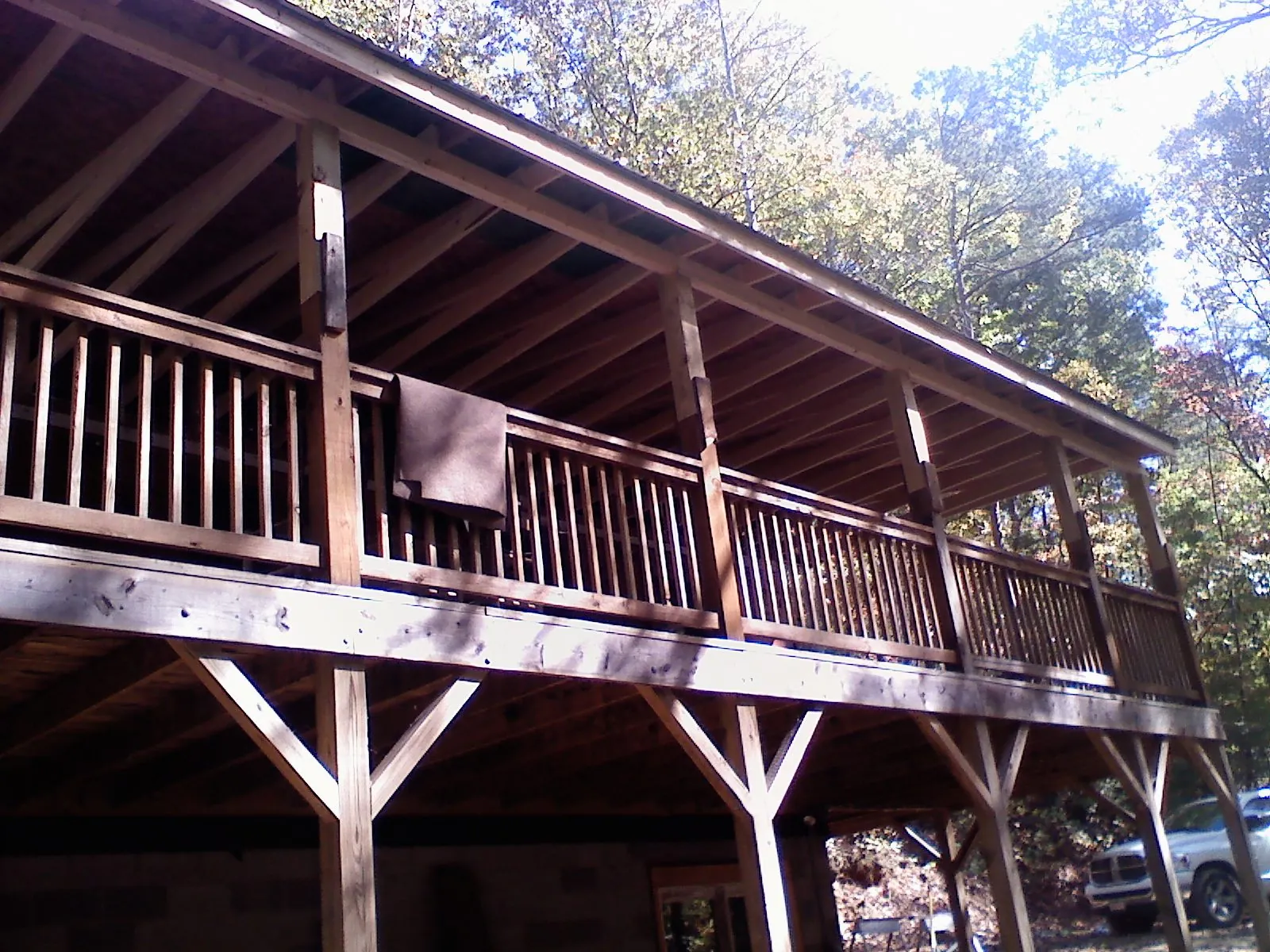 Timber framing under a new elevated porch and deck — Roof Leak Repair in Bergen by Roofing Brothers